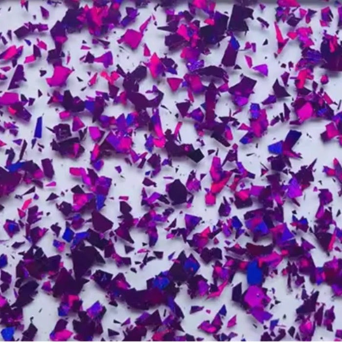 Close-up of Purple Confetti Glitter Acrylic Sheet. Rich purple sheet with bright multicolor glitter for a bold finish. Ideal for event accents, personalized gifts, and fun party designs. Compatible with laser cutters like Glowforge, xTool, and OMTech. Ideal for precise cuts and detailed designs. Perfect for hobbyists, Etsy sellers, and small business owners creating personalized signs, wedding decor, name tags, ornaments, cake toppers, and custom gifts. Pre-cut to fit standard laser beds.