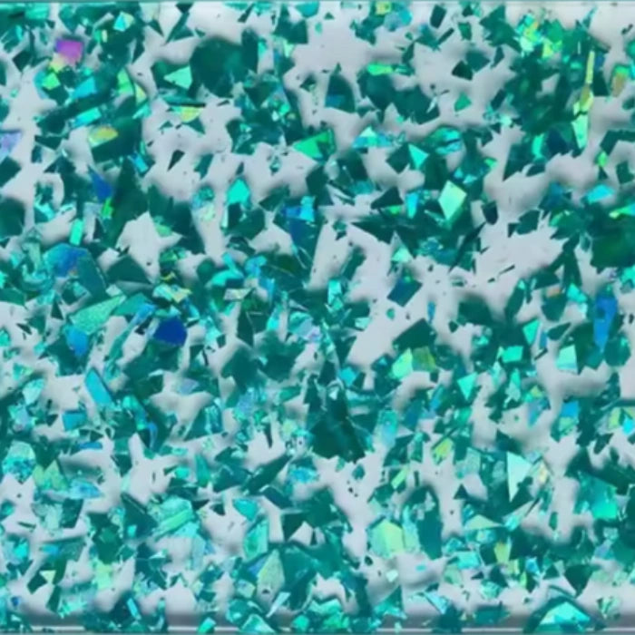 Close-up of Aqua Confetti Glitter Acrylic Sheet. Bright turquoise base with scattered rainbow glitter. Great for beach-themed crafts, birthday toppers, and vibrant accessories. Compatible with laser cutters like Glowforge, xTool, and OMTech. Ideal for precise cuts and detailed designs. Perfect for hobbyists, Etsy sellers, and small business owners creating personalized signs, wedding decor, name tags, ornaments, cake toppers, and custom gifts. Pre-cut to fit standard laser beds.
